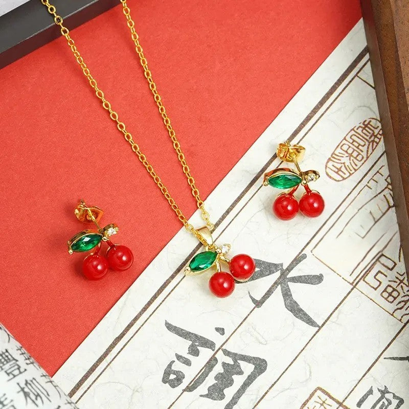 Boucles d'Oreilles Dorés avec Perles Rouges - Cerises Brillantes